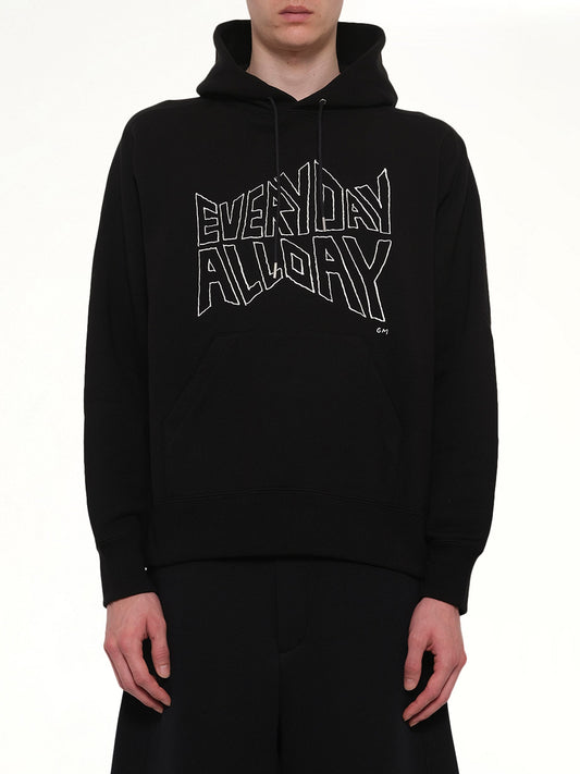 Image of a model wearing Outerwear. Product name - Geoff Sacai Print Hoodie in Black colour by brand - SACAI