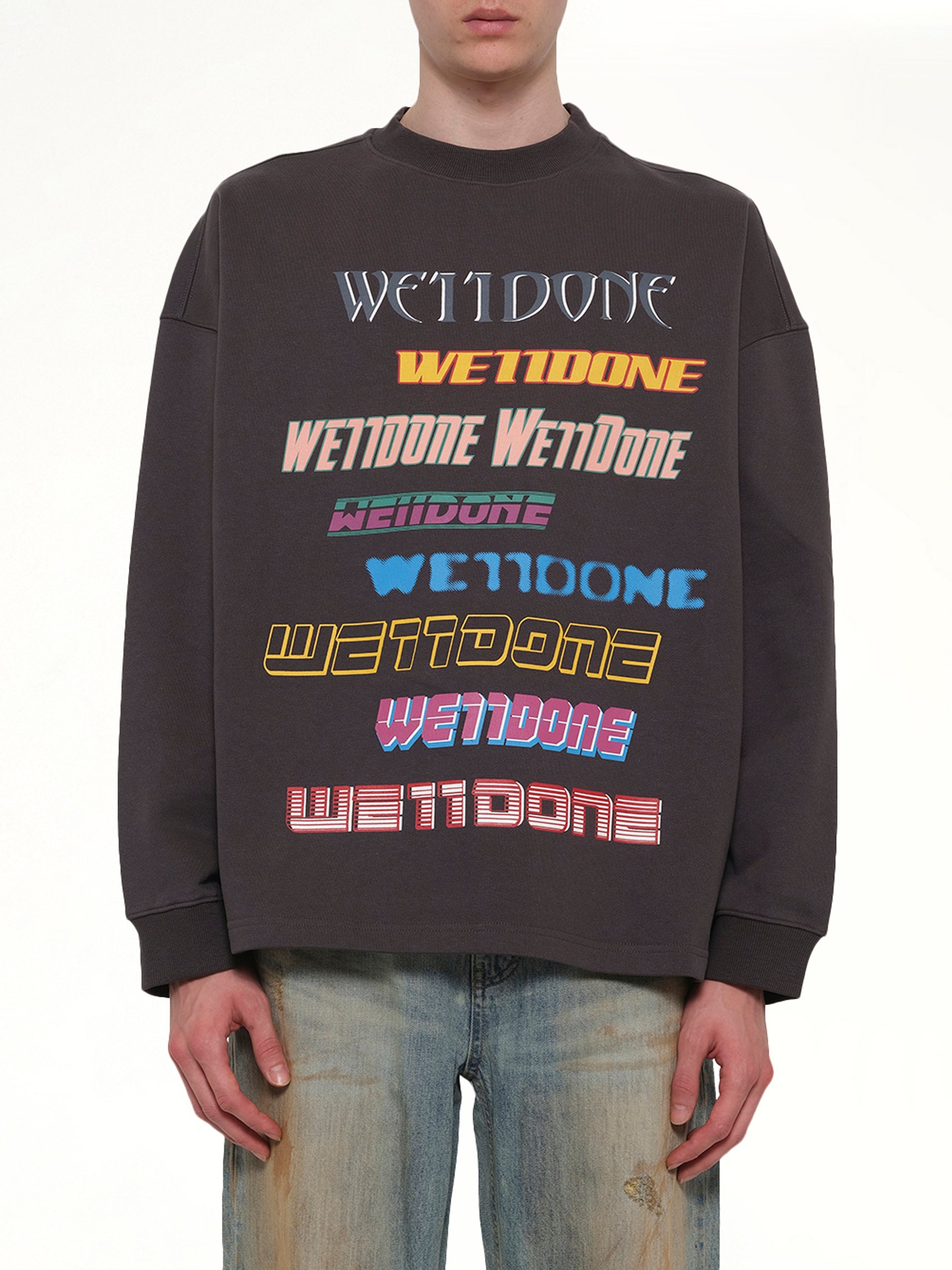 Image of a model wearing Outerwear. Product name - Front Logo Sweatshirt in Grey colour by brand - WE11DONE