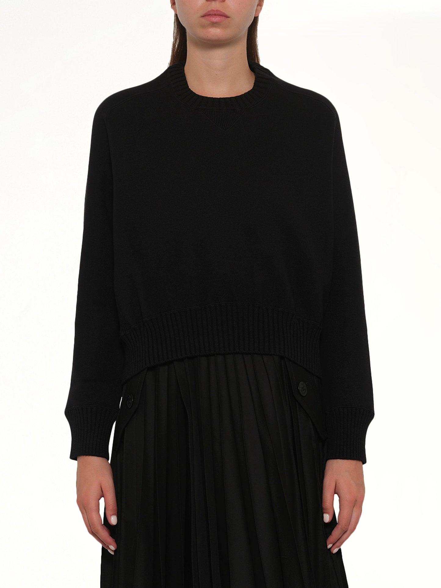Image of a model wearing Outerwear. Product name - Cotton Cashmere Knit Pullover in Black colour by brand - SACAI