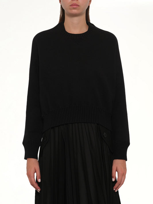 Image of a model wearing Outerwear. Product name - Cotton Cashmere Knit Pullover in Black colour by brand - SACAI