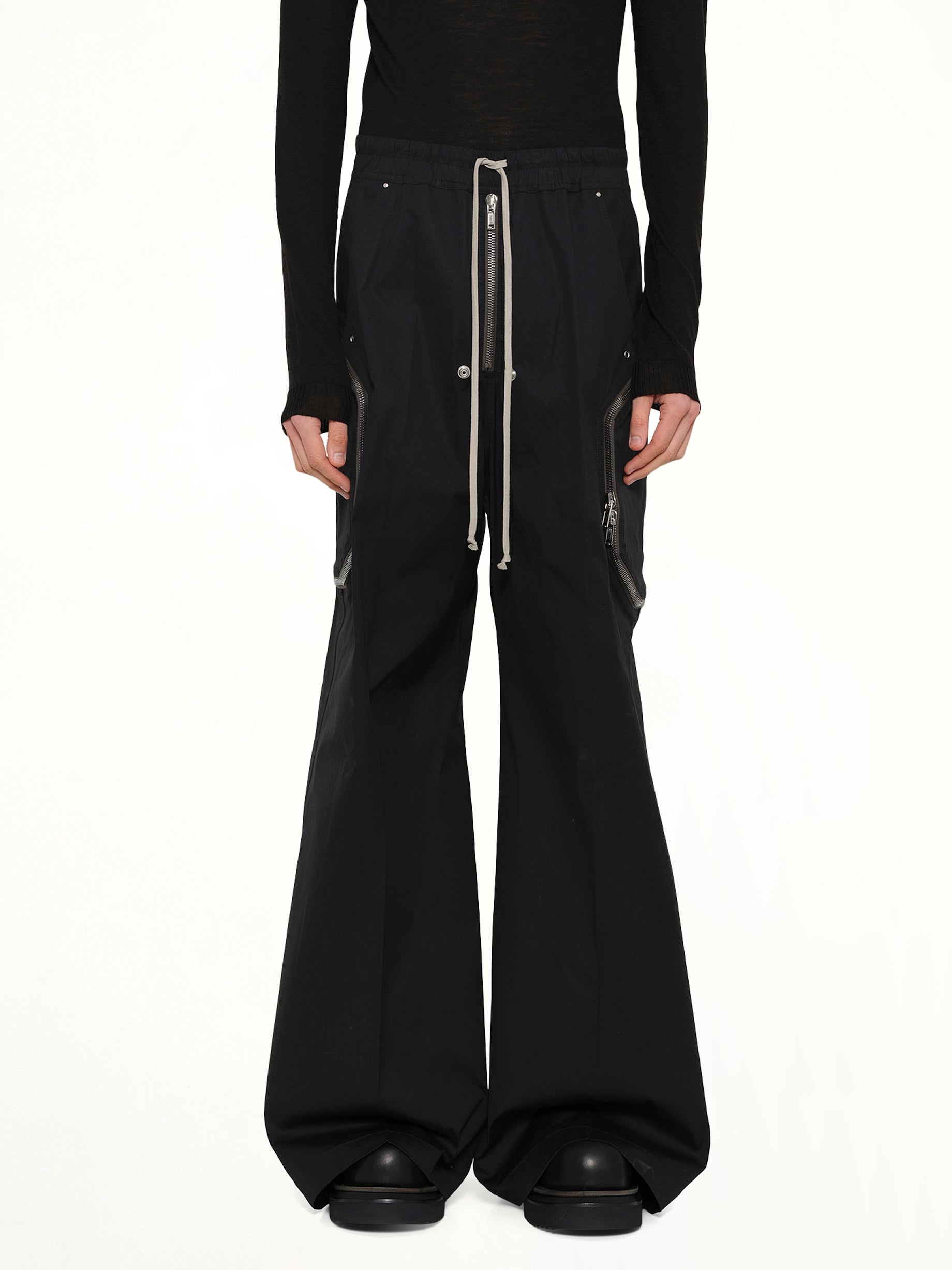 Image of a model wearing Pants. Product name - Heizer Belas in Black colour by brand - RICK OWENS
