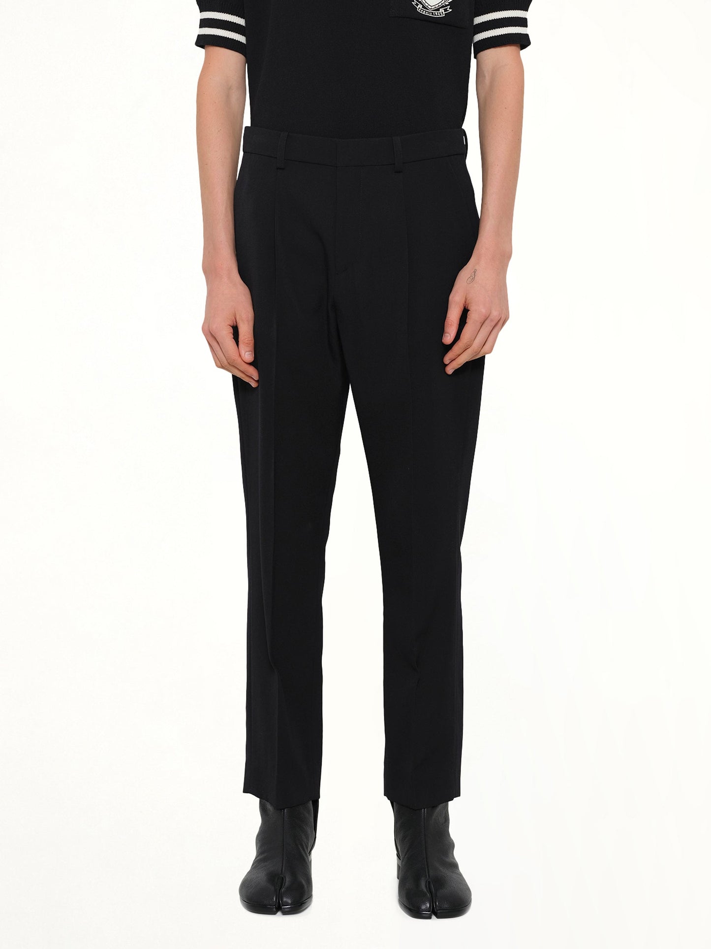 Image of a model wearing Pants. Product name - Straight GDP Pants in Black colour by brand - BALMAIN