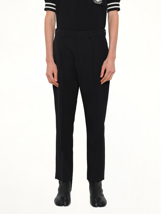 Image of a model wearing Pants. Product name - Straight GDP Pants in Black colour by brand - BALMAIN