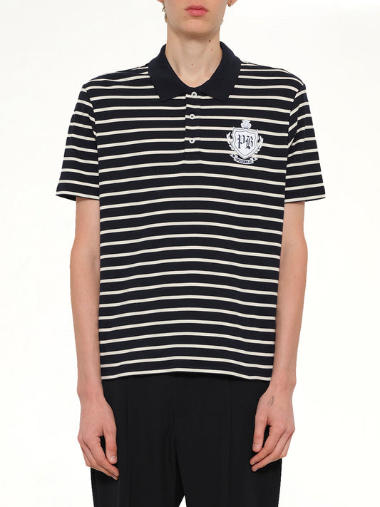 Image of a model wearing Tops. Product name - Marinier College Emblem Polo in Blue colour by brand - BALMAIN