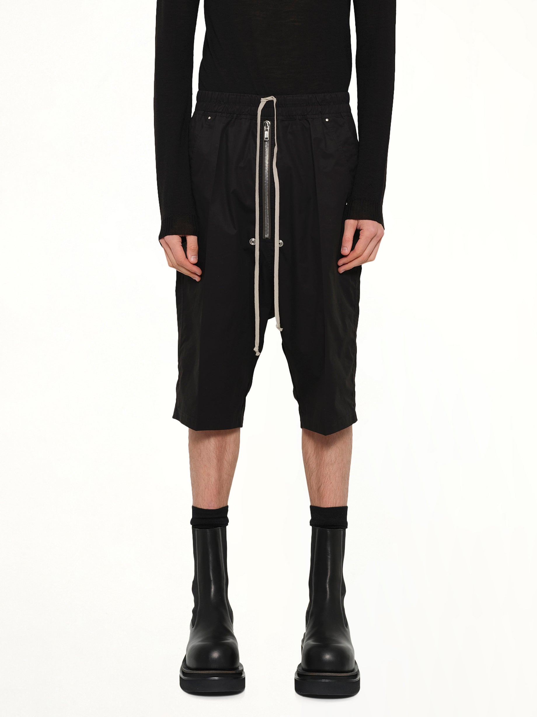 Image of a model wearing Shorts. Product name - Bela Pods in Black colour by brand - RICK OWENS