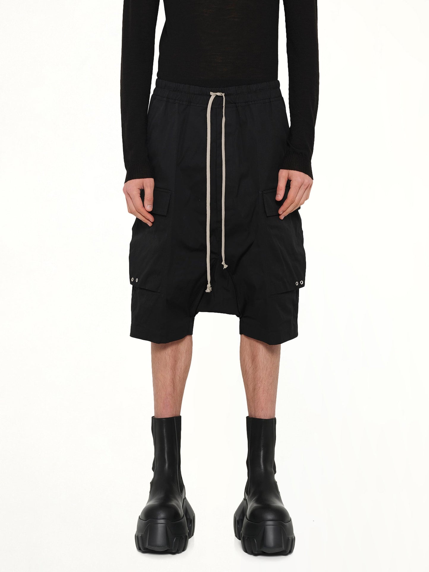 Image of a model wearing Shorts. Product name - Cargo Pods in Black colour by brand - RICK OWENS