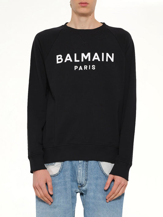Image of a model wearing Outerwear. Product name - Balmain Print Sweatshirt in Black colour by brand - BALMAIN