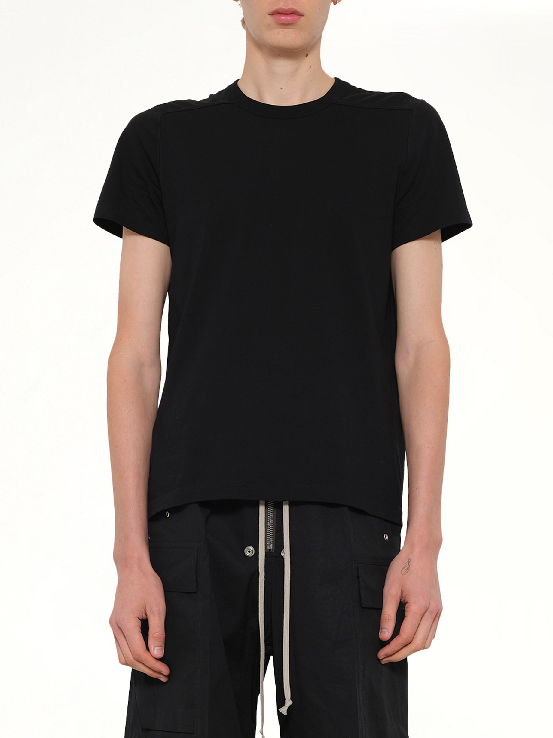 Image of a model wearing Tops. Product name - Short Level T in Black colour by brand - RICK OWENS