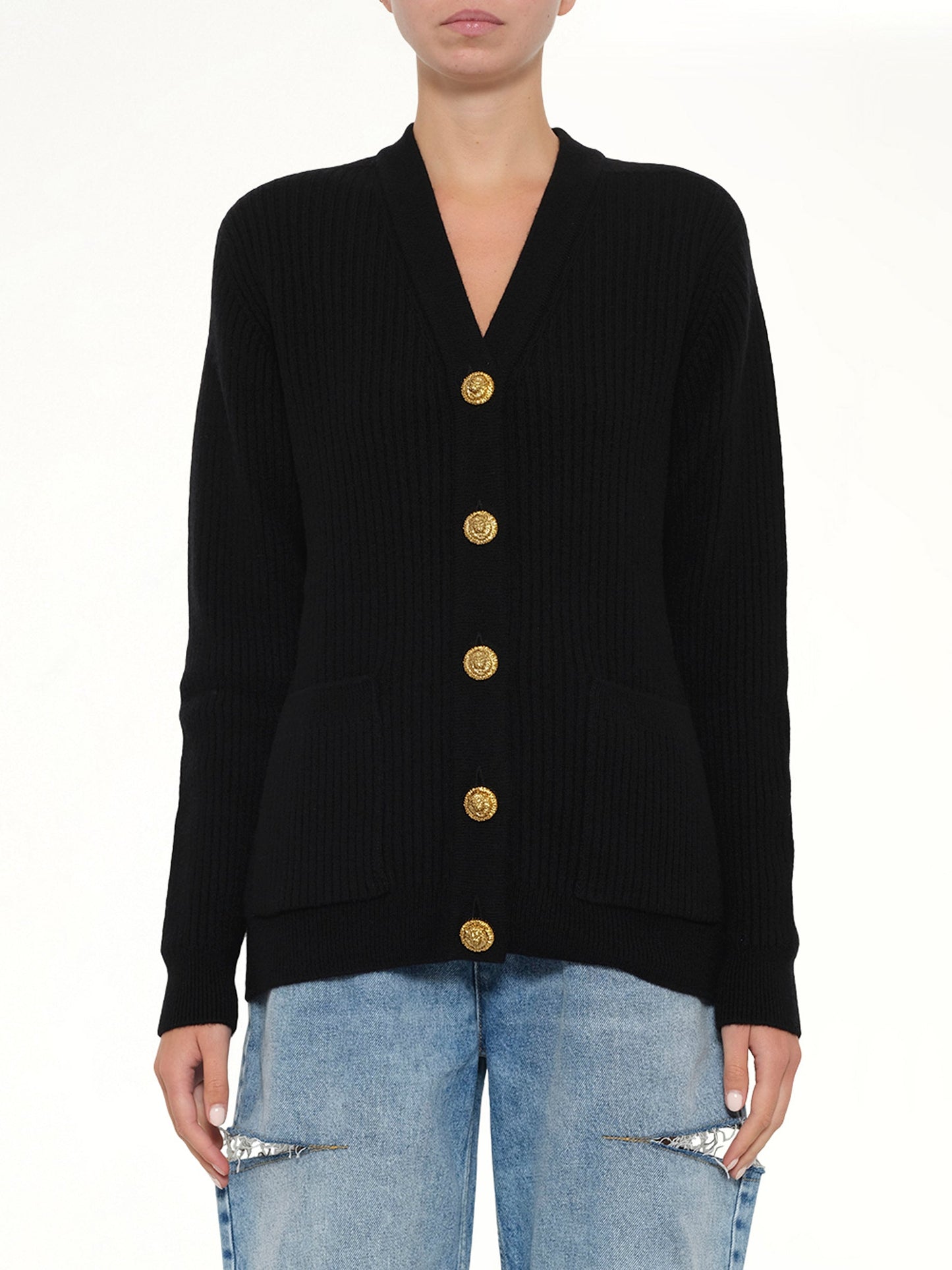 Image of a model wearing Outerwear. Product name - Buttoned Cashmere Cardigan in Black colour by brand - BALMAIN