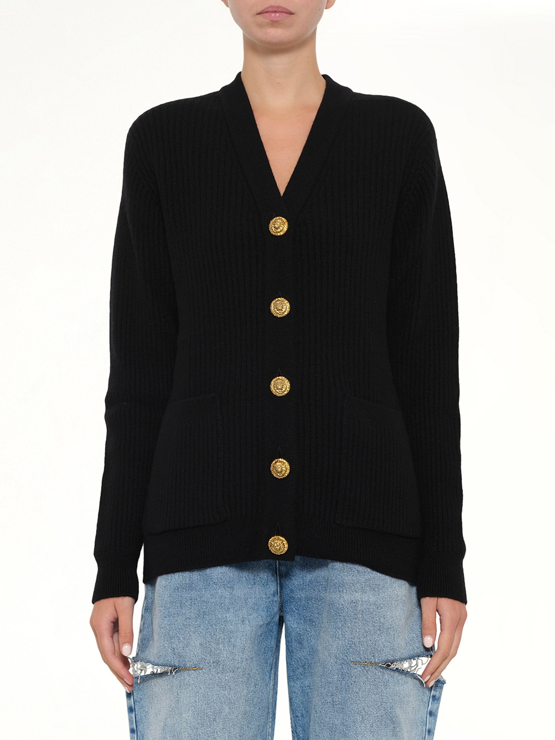 Image of a model wearing Outerwear. Product name - Buttoned Cashmere Cardigan in Black colour by brand - BALMAIN