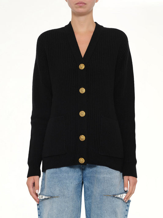 Image of a model wearing Outerwear. Product name - Buttoned Cashmere Cardigan in Black colour by brand - BALMAIN