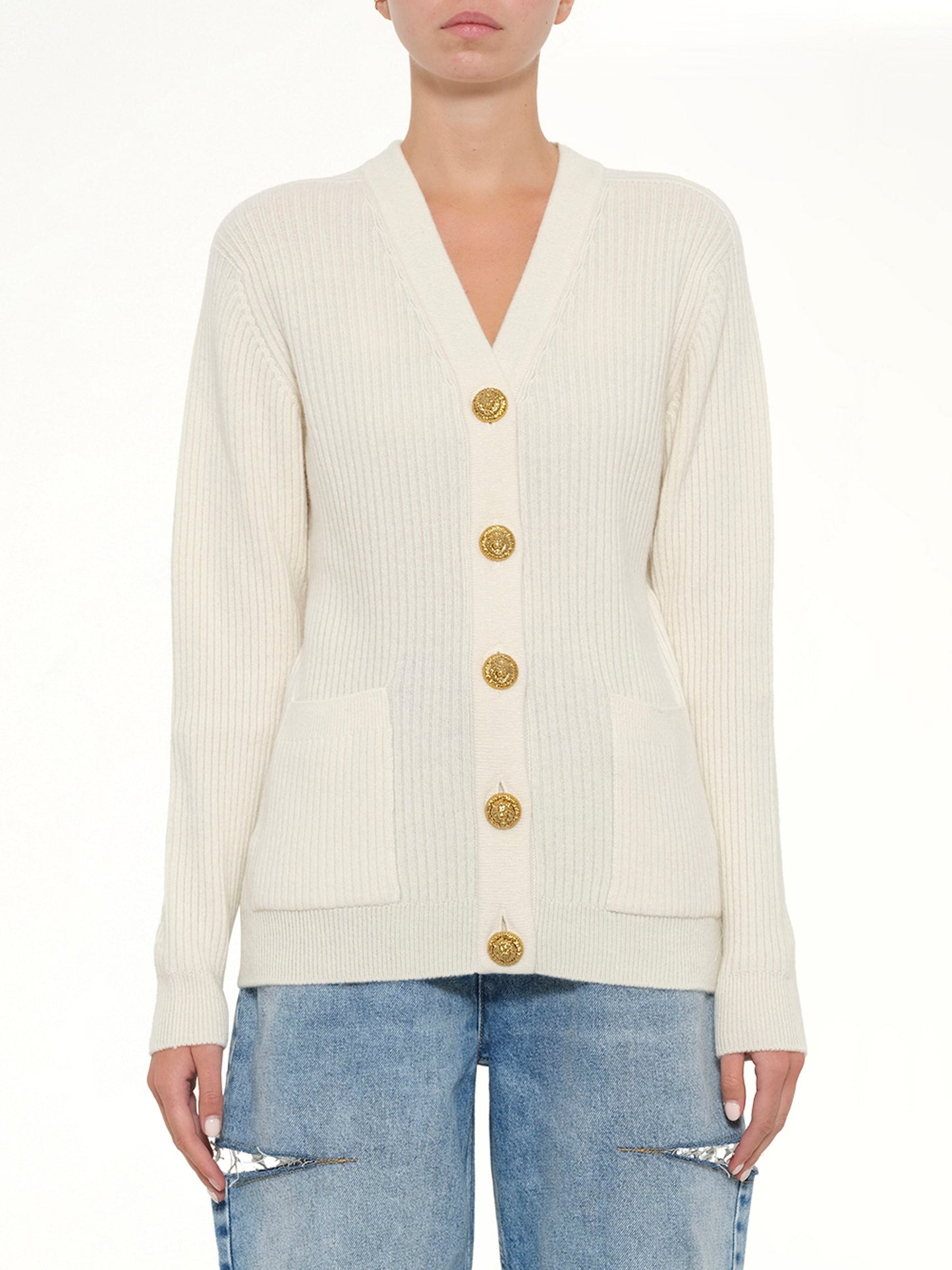 Image of a model wearing Outerwear. Product name - Buttoned Cashmere Cardigan in Natural colour by brand - BALMAIN
