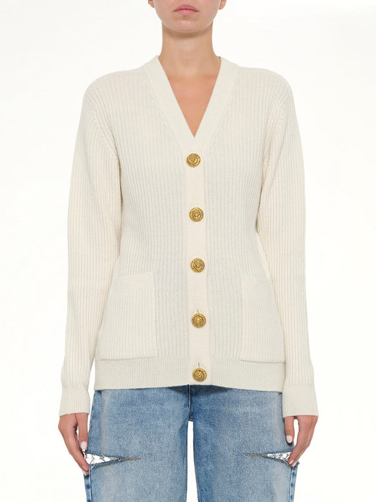 Image of a model wearing Outerwear. Product name - Buttoned Cashmere Cardigan in Natural colour by brand - BALMAIN