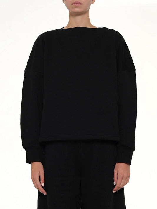 Image of a model wearing Outerwear. Product name - Boatneck Sweatshirt in Black colour by brand - ALAIA
