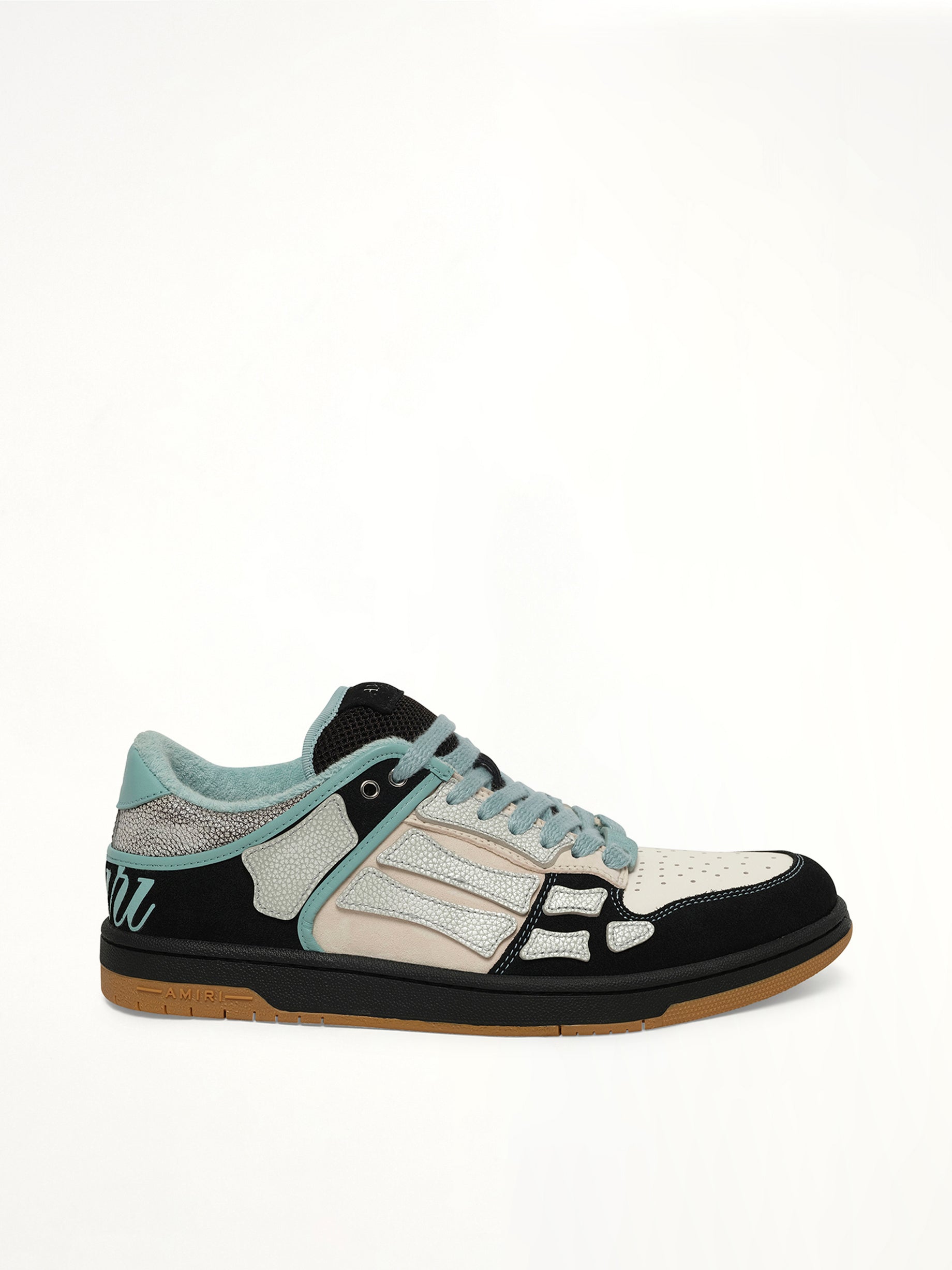 Image of Sneakers. Product name - XL Skel Top Low Sneaker in Black colour by brand - AMIRI