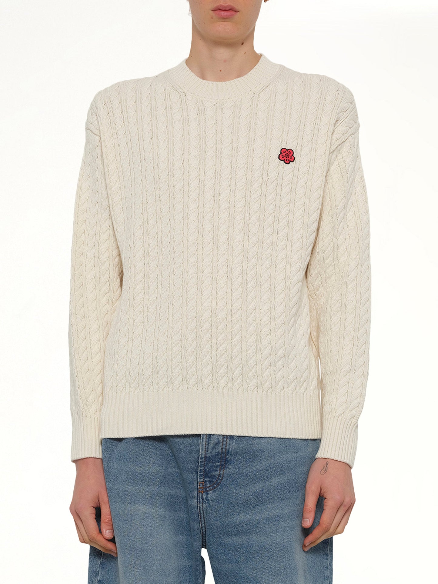 Image of a model wearing Outerwear. Product name - Boke Flower Cable Knit Jumper in Beige colour by brand - KENZO
