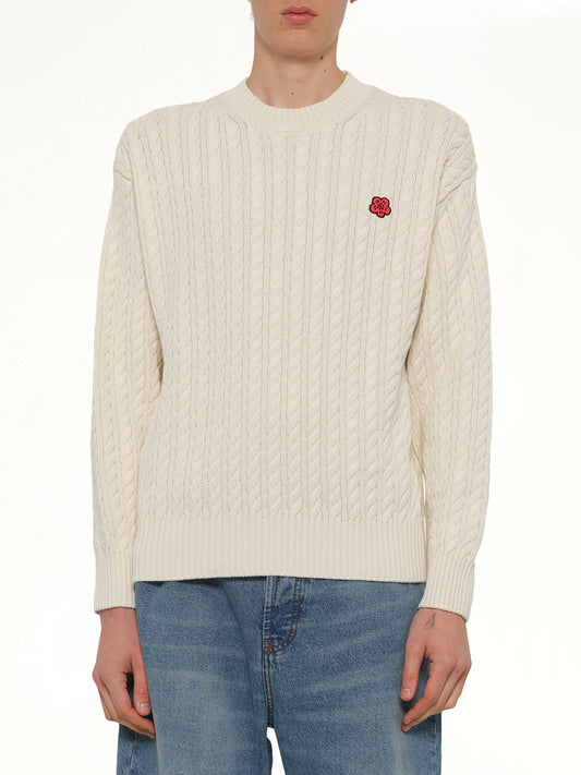Image of a model wearing Outerwear. Product name - Boke Flower Cable Knit Jumper in Beige colour by brand - KENZO