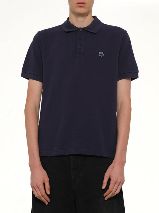 Image of a model wearing Tops. Product name - Gots Boke Flower Embroidered Slim Polo in Navy colour by brand - KENZO