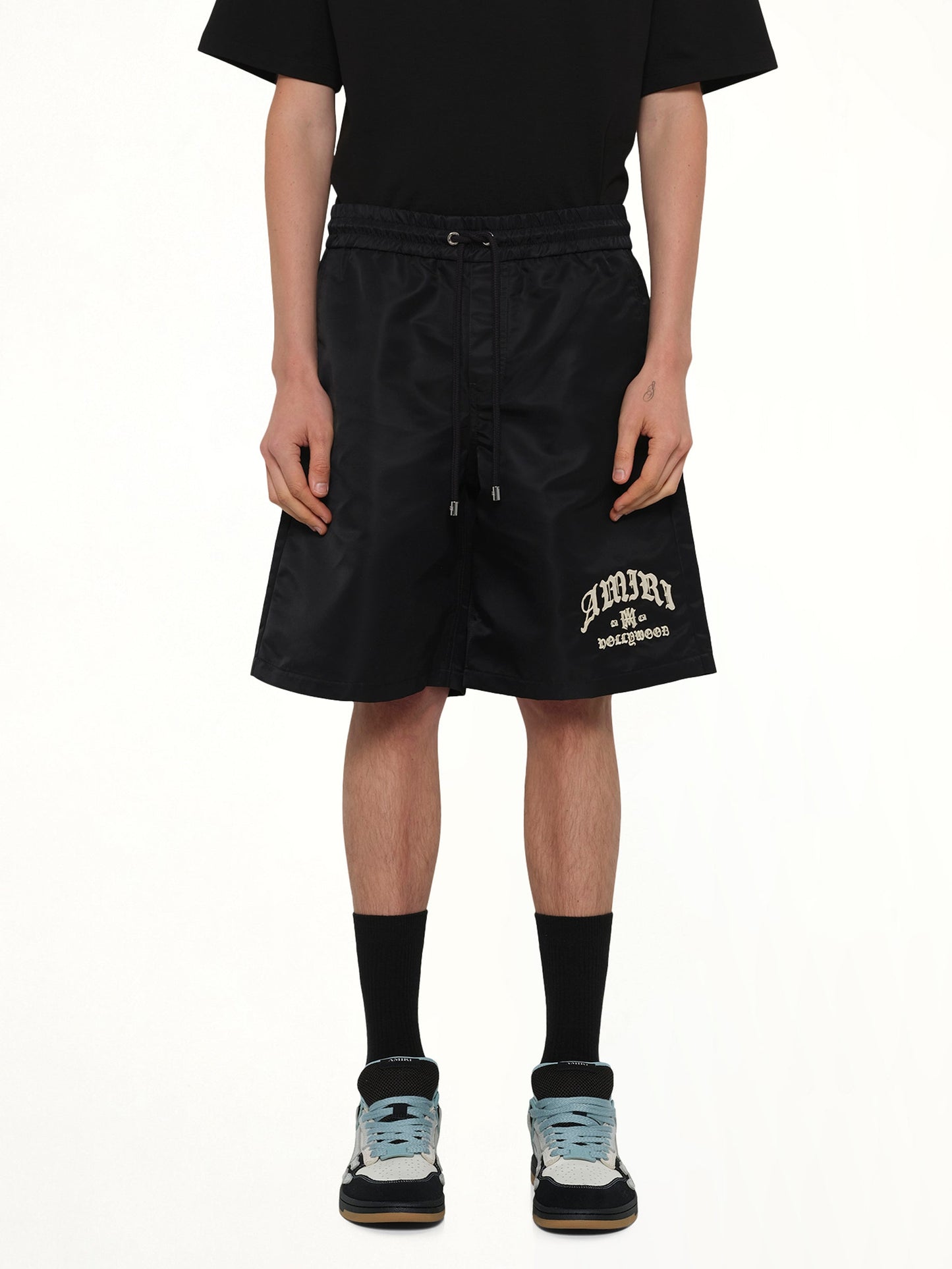 Image of a model wearing Shorts. Product name - Amiri Hollywood Short in Black colour by brand - AMIRI