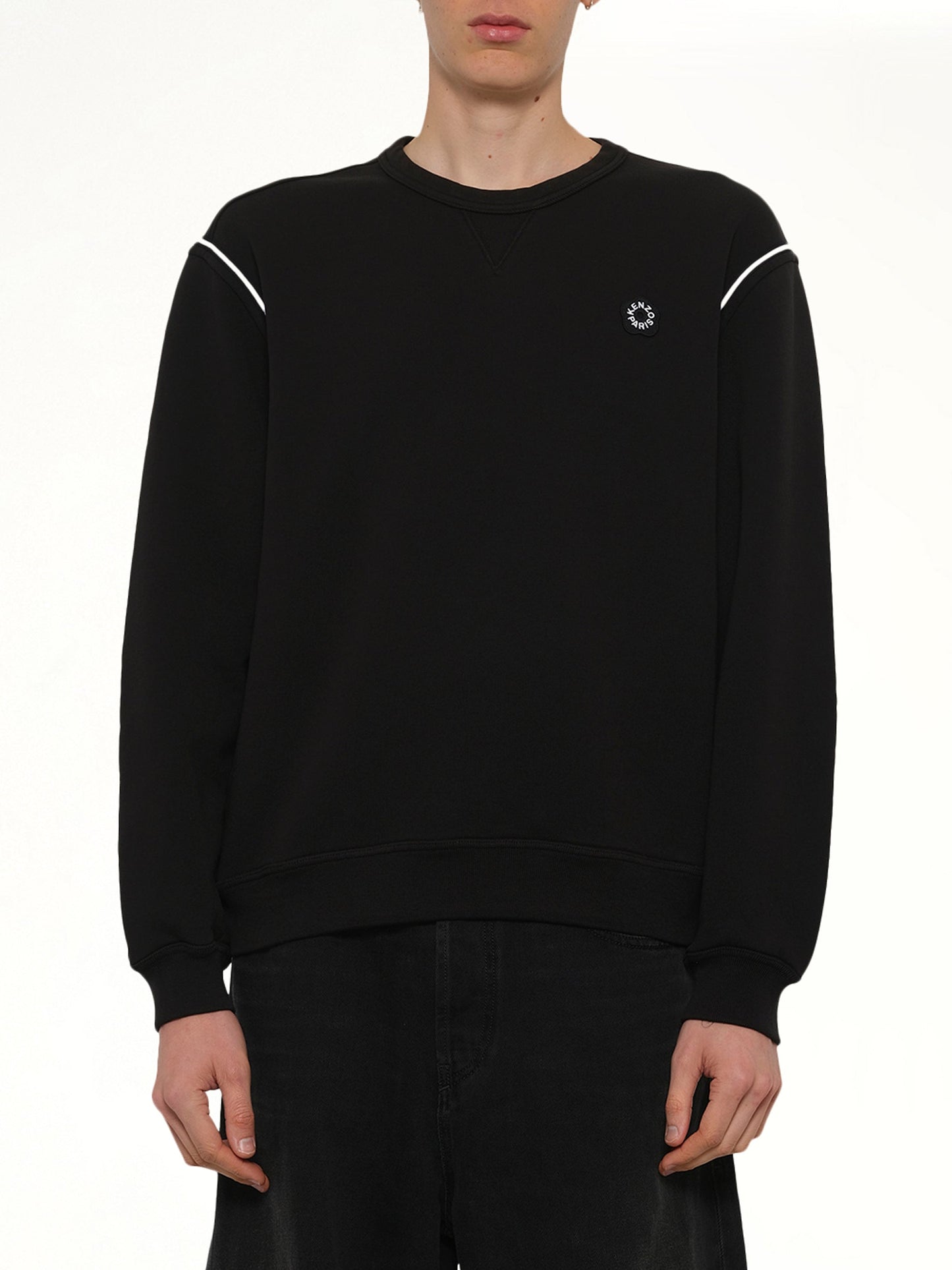 Image of a model wearing Outerwear. Product name - Boke Flower 2.0 Embroidered Classic Sweatshirt in Black colour by brand - KENZO