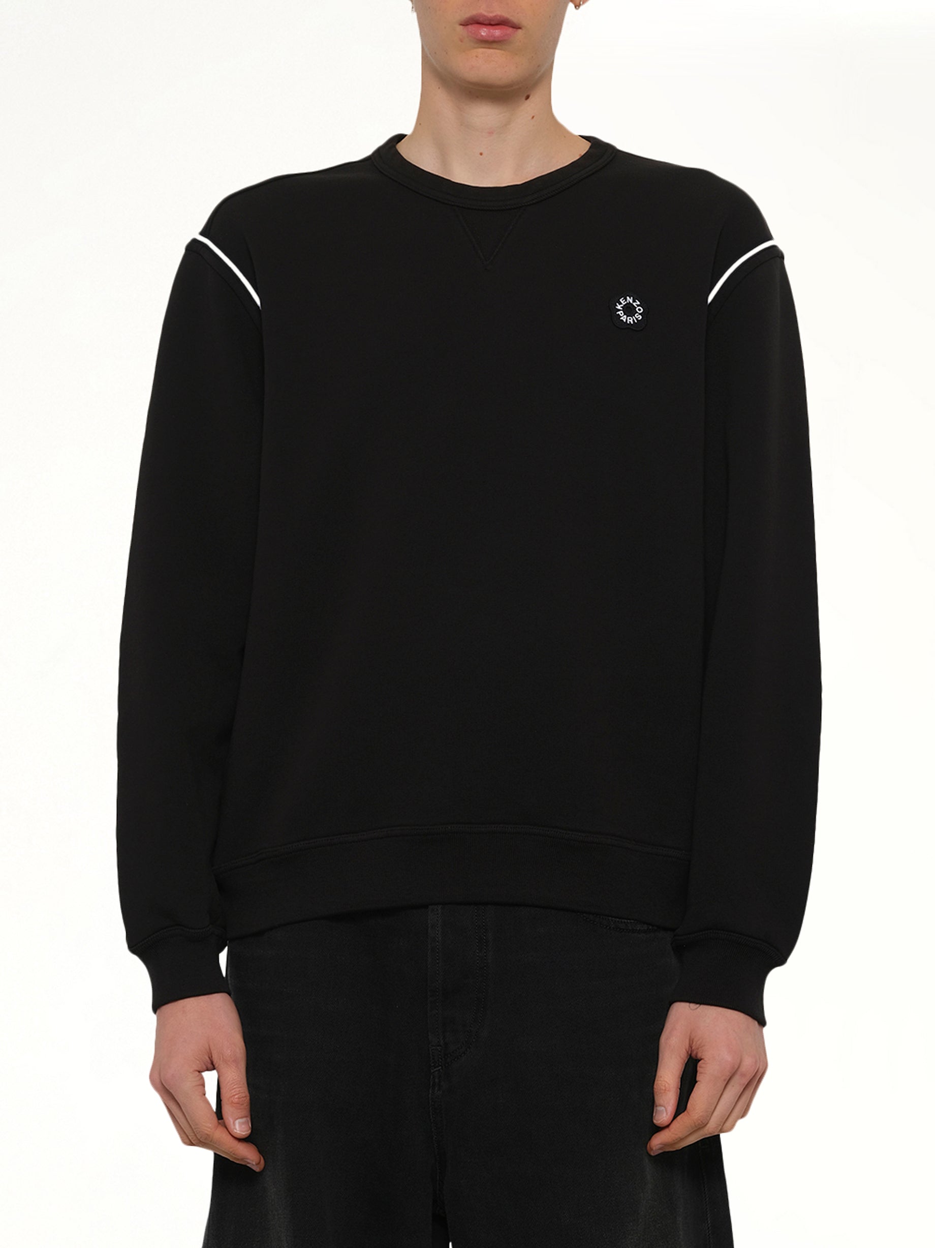 Image of a model wearing Outerwear. Product name - Boke Flower 2.0 Embroidered Classic Sweatshirt in Black colour by brand - KENZO