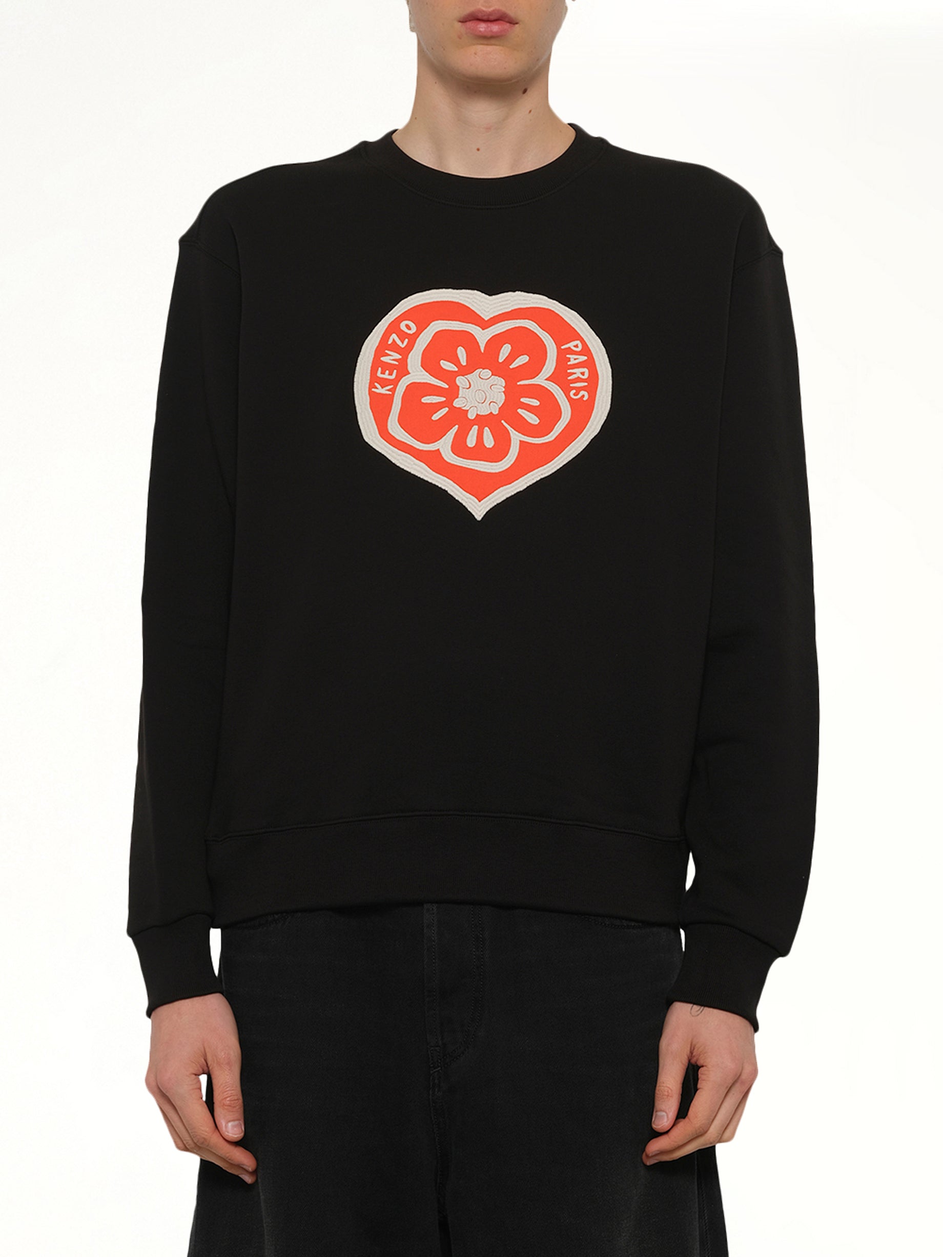 Image of a model wearing Outerwear. Product name - Kenzo Boke Heart Classic Sweatshirt in Black colour by brand - KENZO