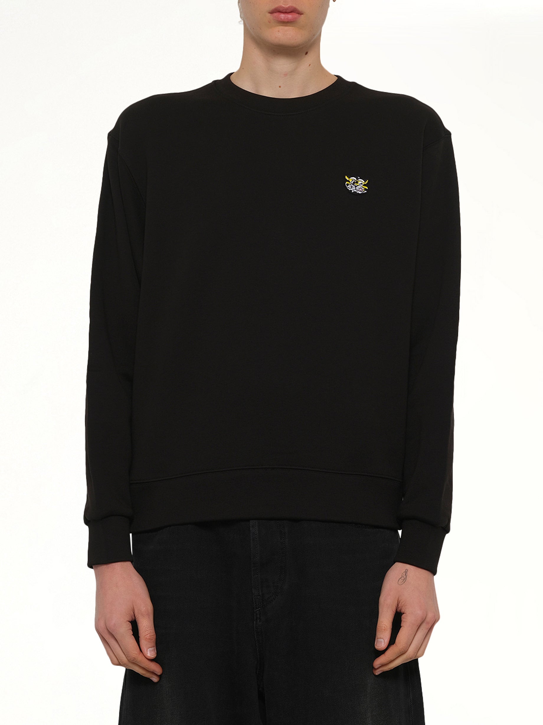 Image of a model wearing Outerwear. Product name - Kenzo Wild Tiger Classic Sweatshirt in Black colour by brand - KENZO