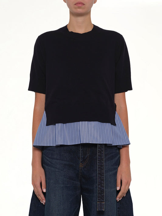 Image of a model wearing Outerwear. Product name - Poplin x Cotton Knit Pullover in Navy colour by brand - SACAI