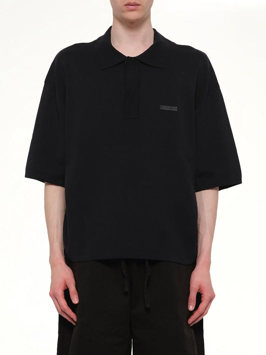 Image of a model wearing Tops. Product name - SS Club Polo in Black colour by brand - ENTIRE STUDIOS