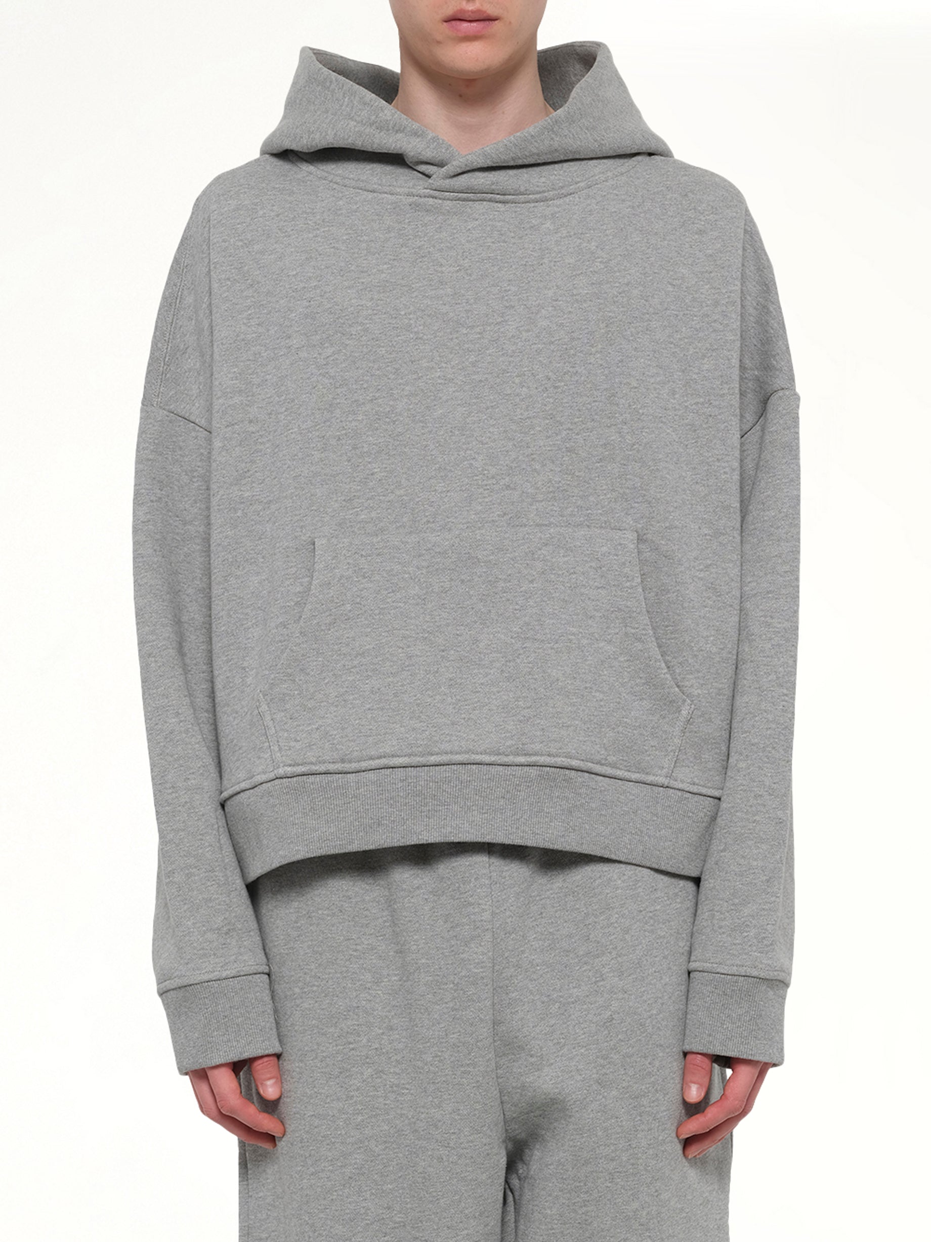 Image of a model wearing Outerwear. Product name - Heavy Hood in Grey colour by brand - ENTIRE STUDIOS