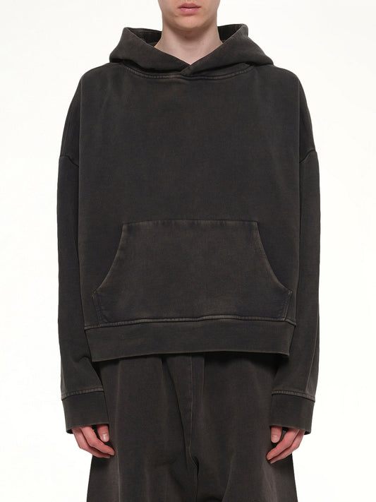 Image of a model wearing Outerwear. Product name - Heavy Hood in Black colour by brand - ENTIRE STUDIOS