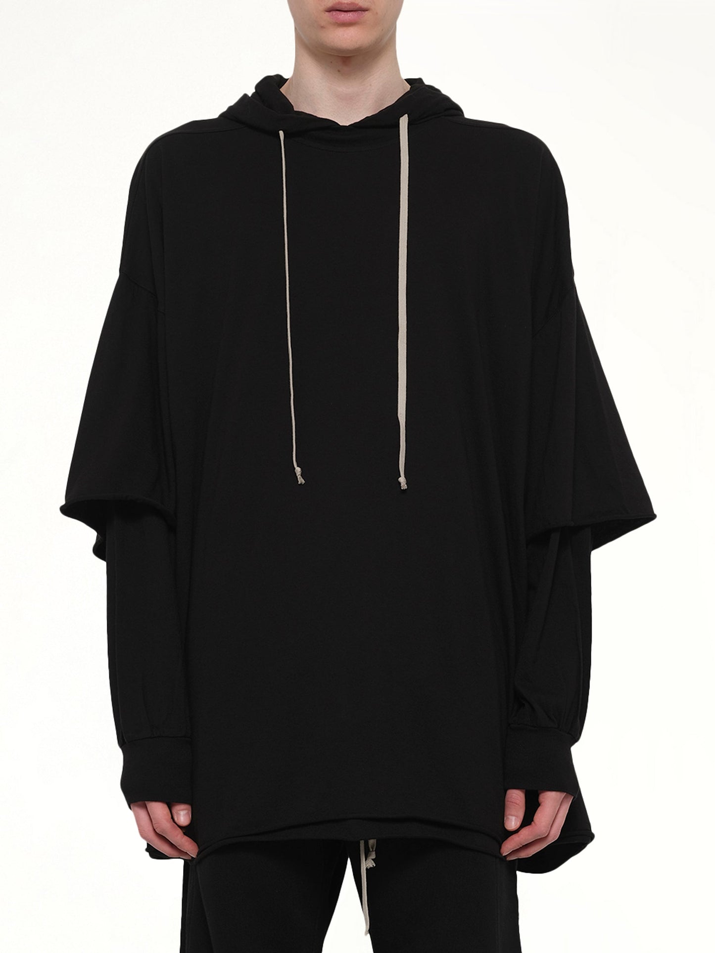 Image of a model wearing Outerwear. Product name - Tommy Hustler Hoodie in Black colour by brand - RICK OWENS DRKSHDW