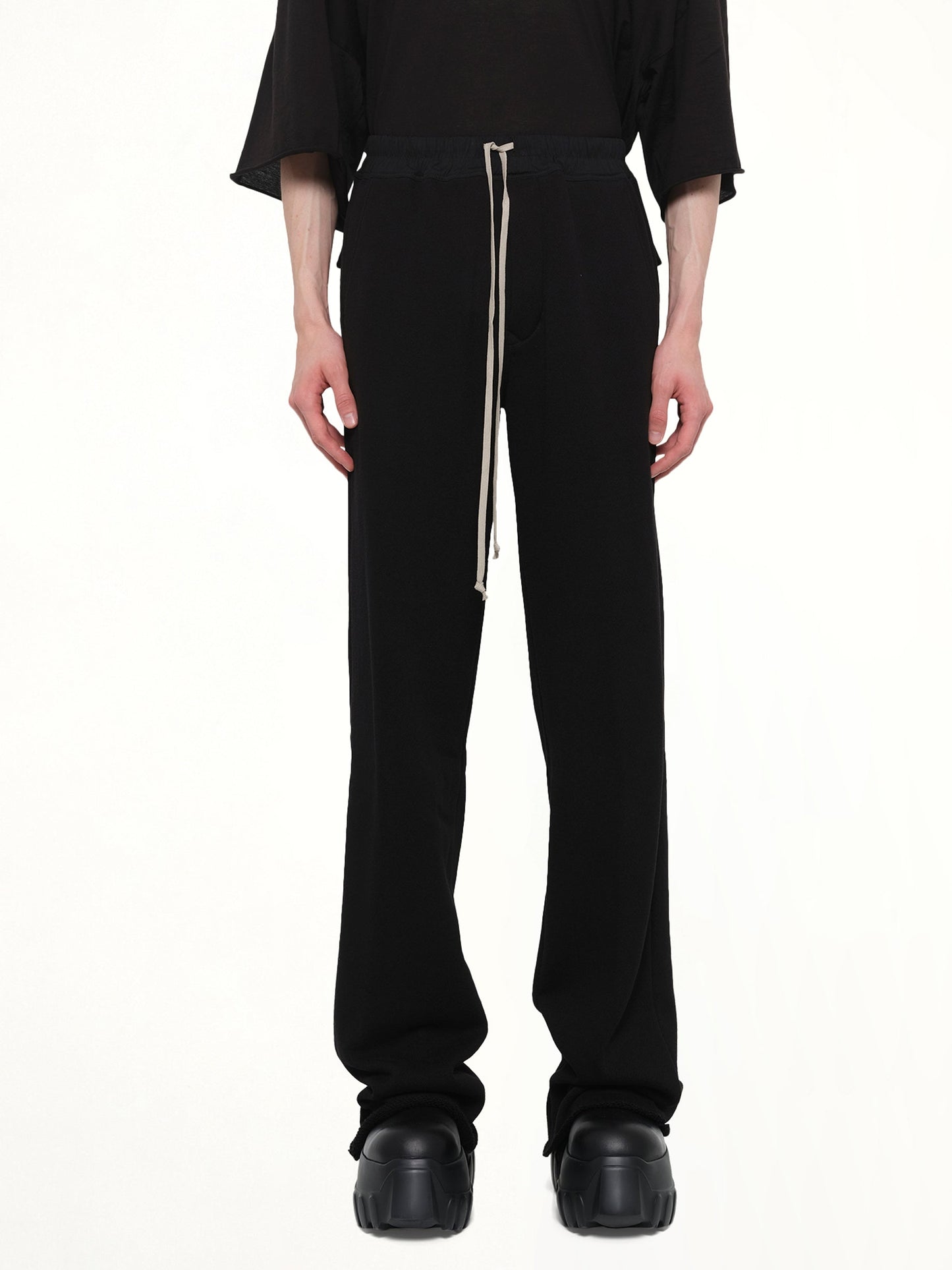 Image of a model wearing Pants. Product name - Dietrich Drawstring in Black colour by brand - RICK OWENS