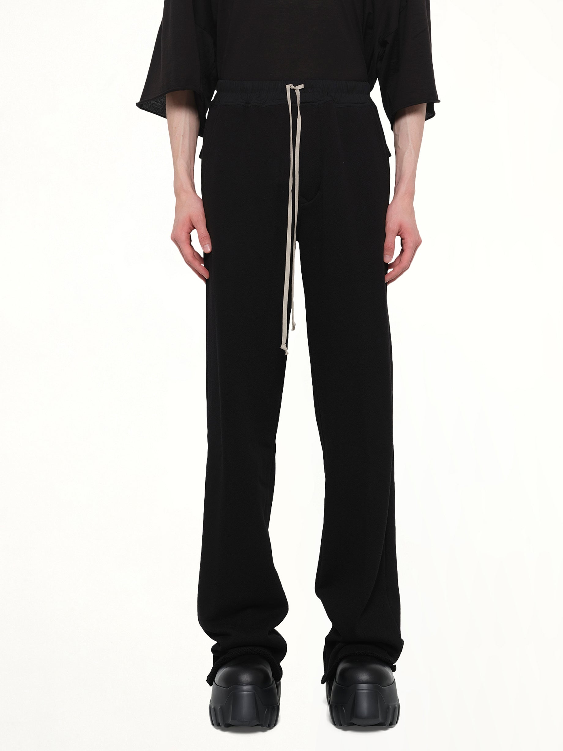Image of a model wearing Pants. Product name - Dietrich Drawstring in Black colour by brand - RICK OWENS