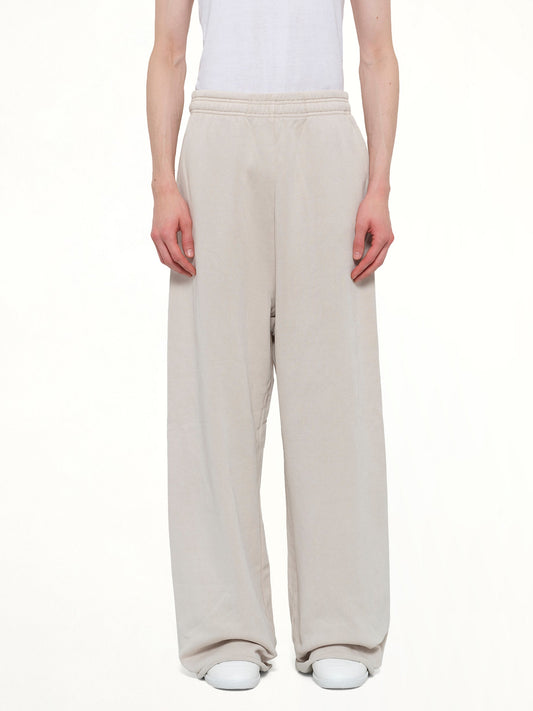Image of a model wearing Pants. Product name - Full Sweatpant in White colour by brand - ENTIRE STUDIOS