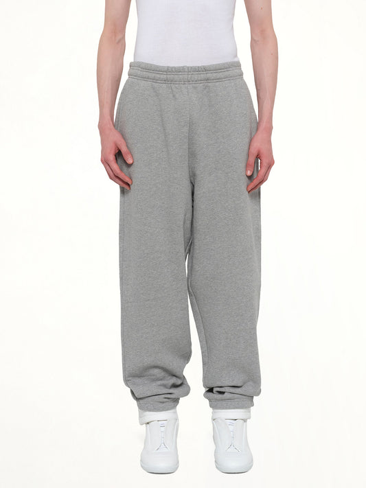 Image of a model wearing Pants. Product name - Standard Sweatpants in Grey colour by brand - ENTIRE STUDIOS