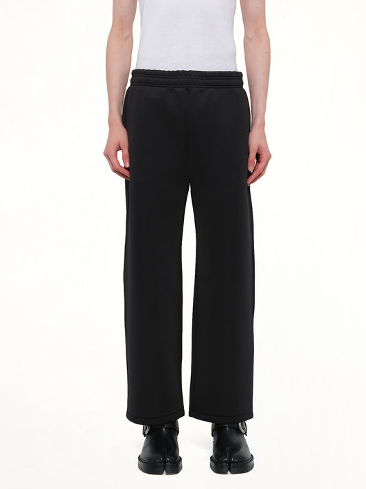 Image of a model wearing Pants. Product name - Straight Leg Scuba Sweatpants in Black colour by brand - ENTIRE STUDIOS