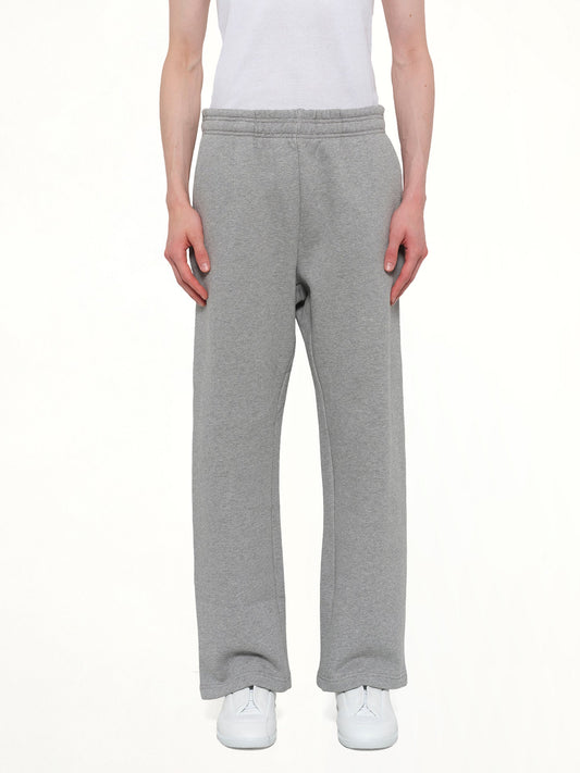 Image of a model wearing Pants. Product name - Straight Leg Sweatpant in Grey colour by brand - ENTIRE STUDIOS