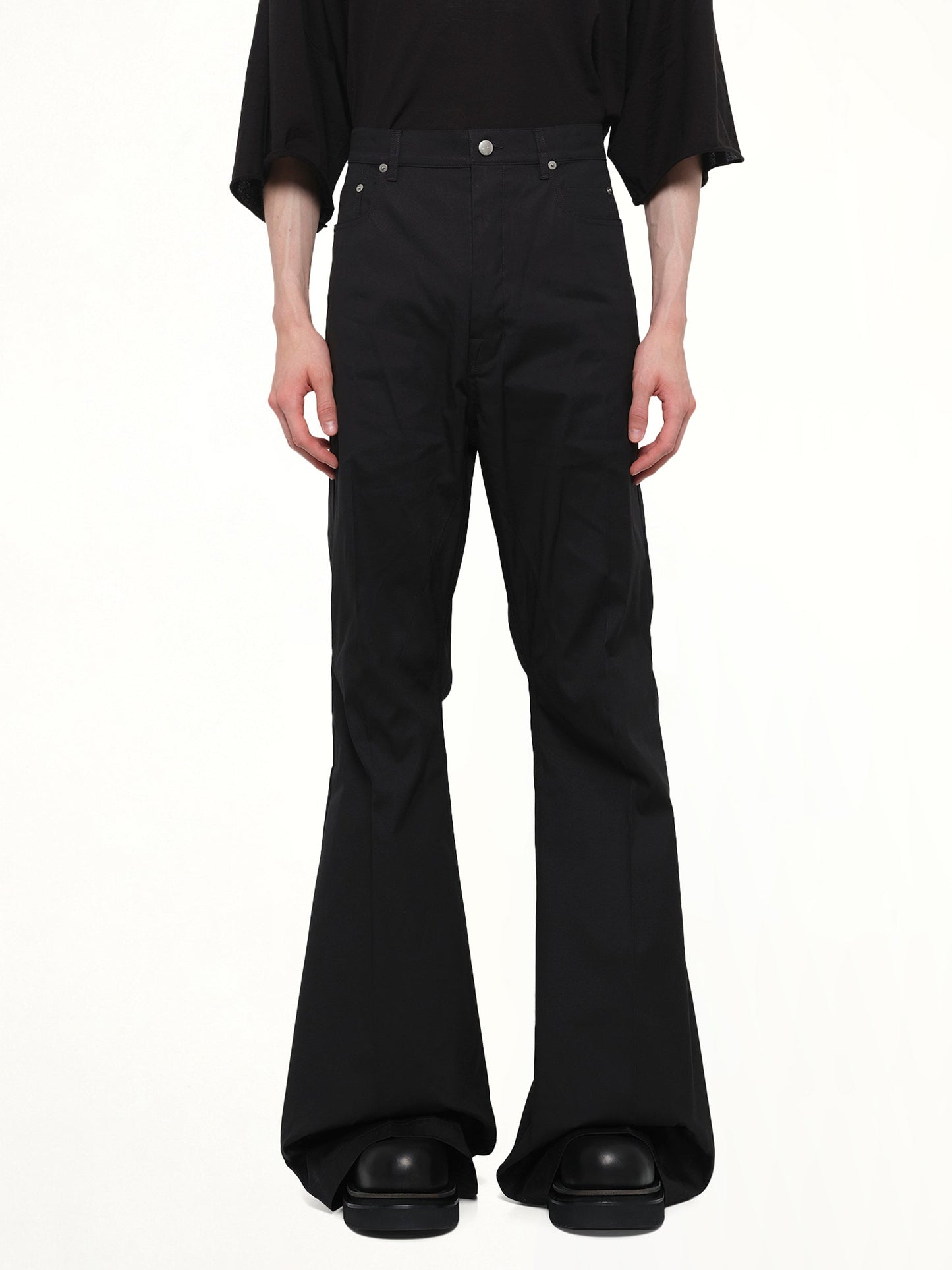 Image of a model wearing Pants. Product name - Cotton Poplin Bolan Bootcut in Black colour by brand - RICK OWENS