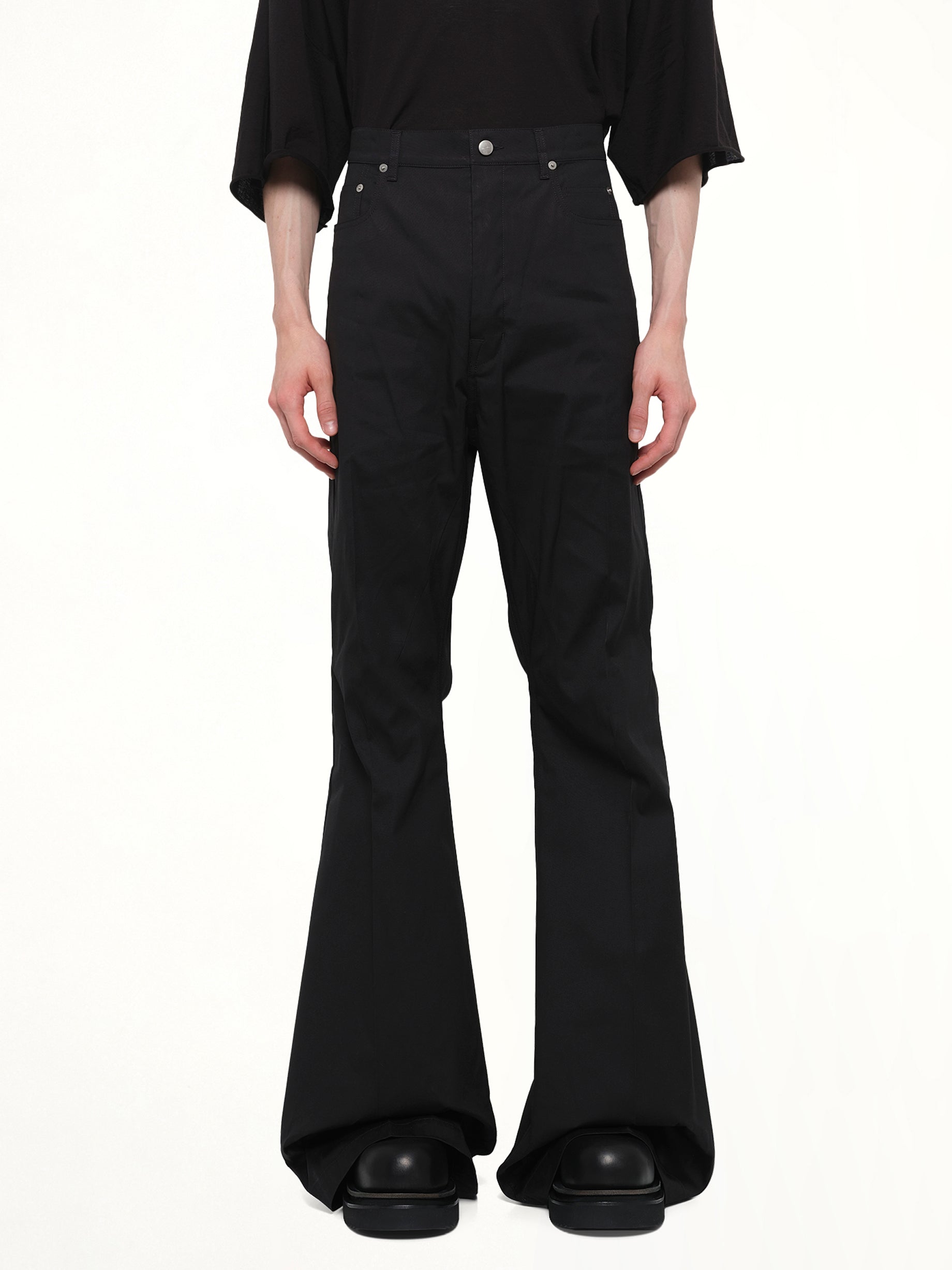 Image of a model wearing Pants. Product name - Cotton Poplin Bolan Bootcut in Black colour by brand - RICK OWENS