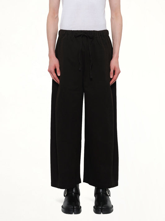 Image of a model wearing Pants. Product name - Loft Pant in Black colour by brand - ENTIRE STUDIOS