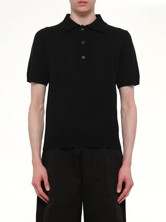 Image of a model wearing Shorts. Product name - Short Sleeve Knit Polo in Black colour by brand - ENTIRE STUDIOS