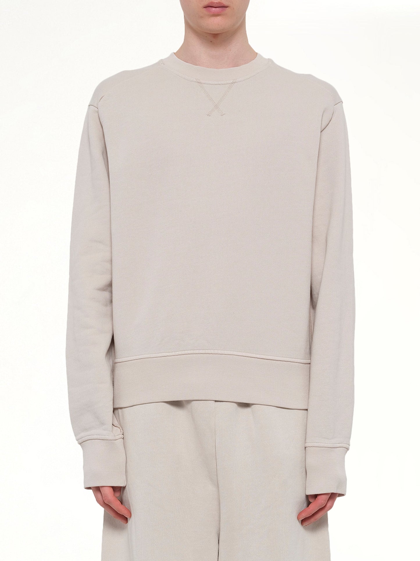 Image of a model wearing Outerwear. Product name - Pod Crew in White colour by brand - ENTIRE STUDIOS