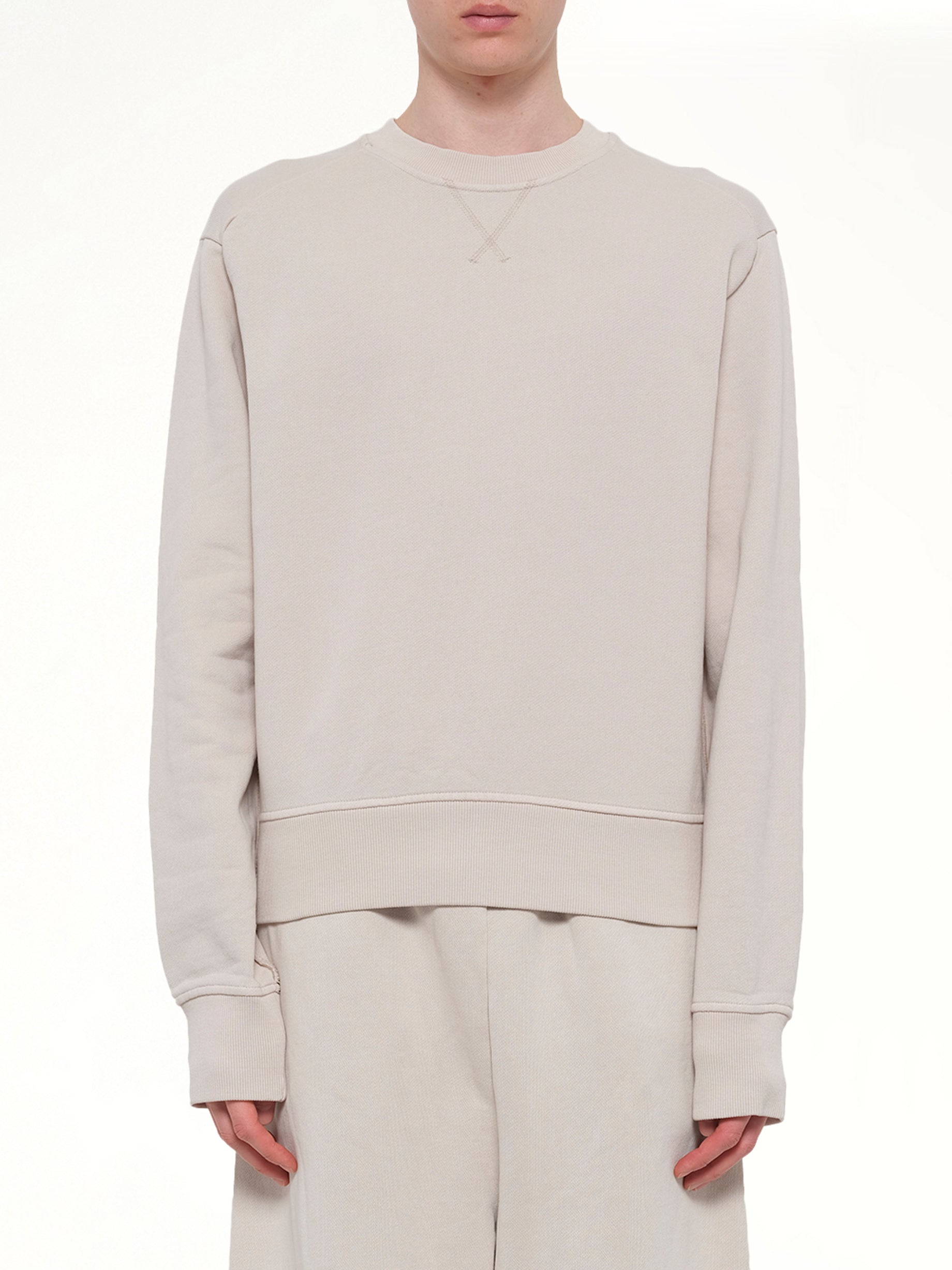 Image of a model wearing Outerwear. Product name - Pod Crew in White colour by brand - ENTIRE STUDIOS