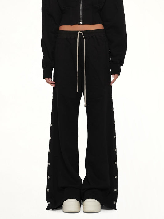 Image of a model wearing Pants. Product name - Wide Pusher Pants in Black colour by brand - RICK OWENS DRKSHDW