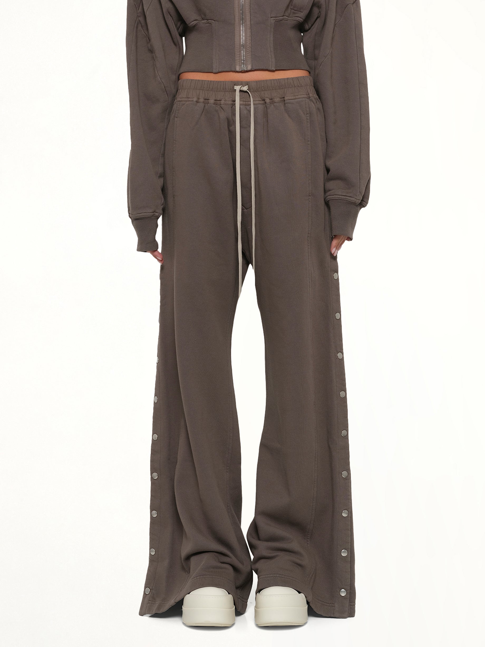 Image of a model wearing Pants. Product name - Wide Pusher Pants in Brown colour by brand - RICK OWENS DRKSHDW