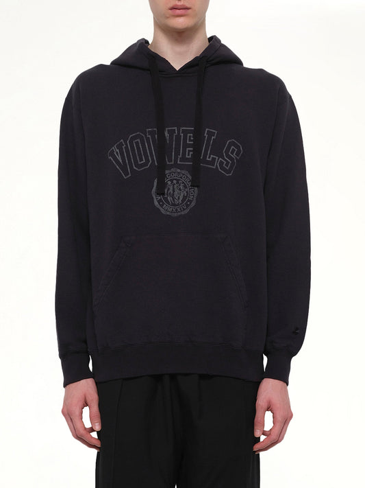 Image of a model wearing Outerwear. Product name - Faded Collegiate Hoodie in Black colour by brand - VOWELS