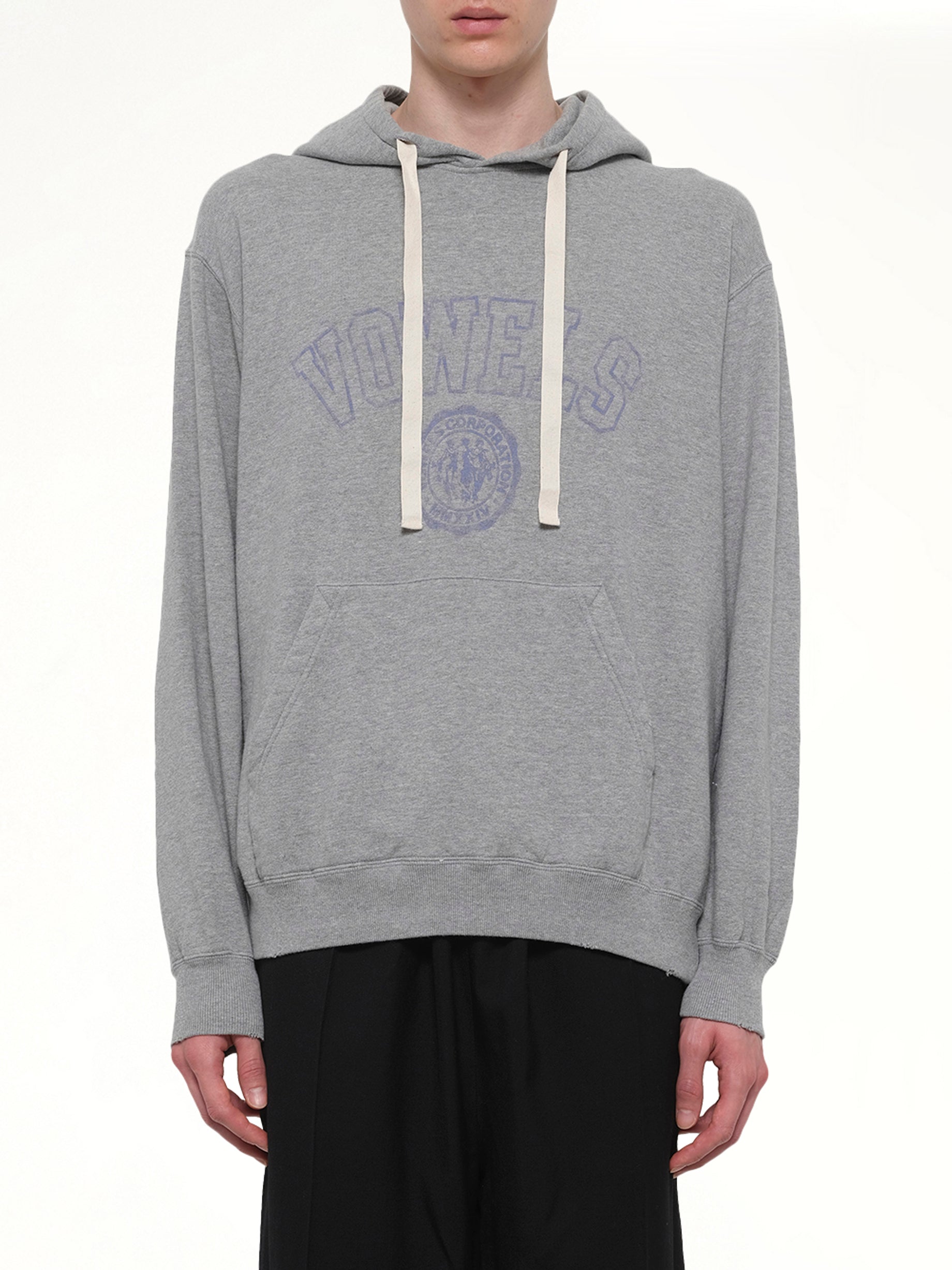 Image of a model wearing Outerwear. Product name - Faded Collegiate Hoodie in Grey colour by brand - VOWELS