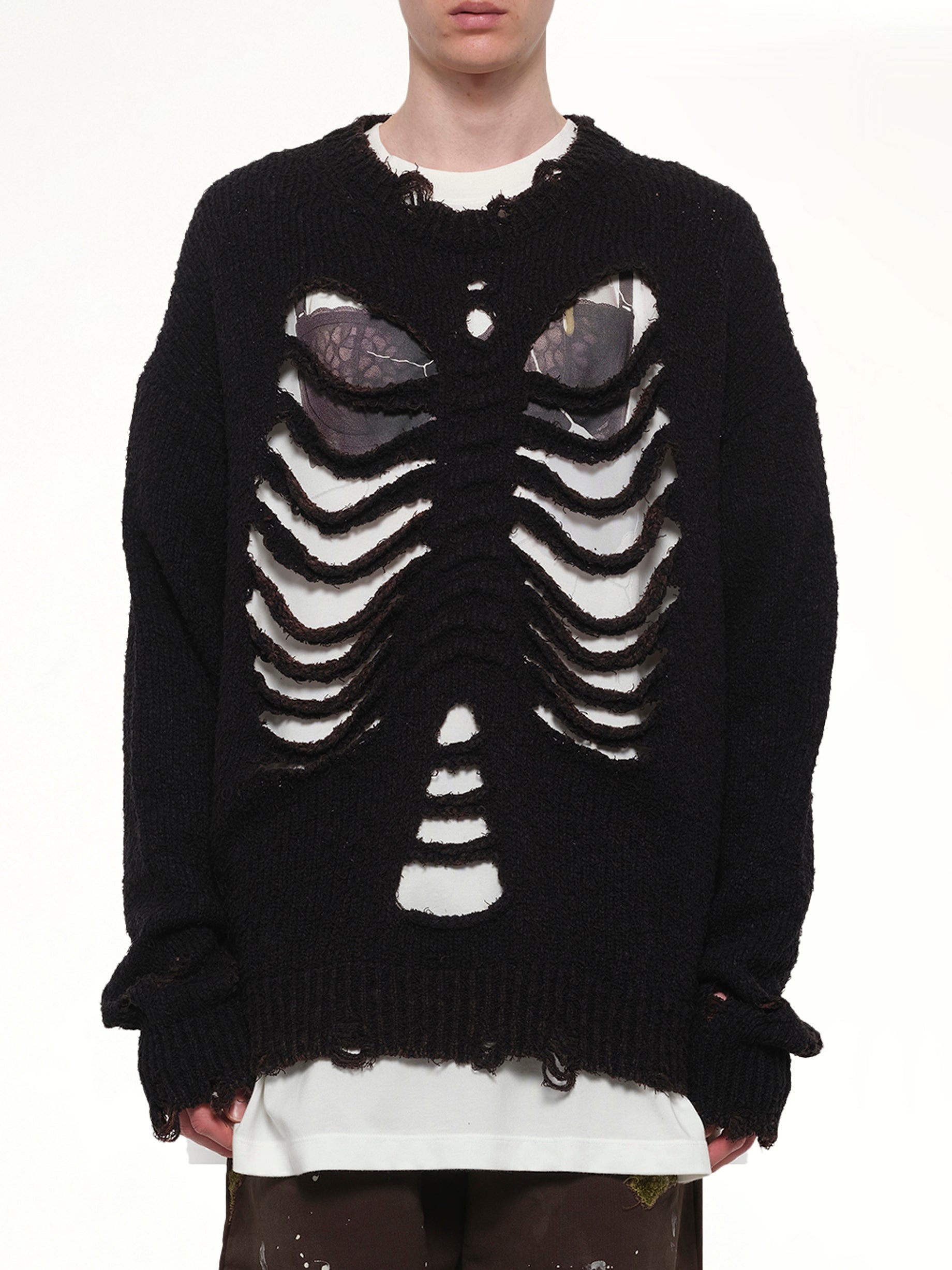 Image of a model wearing Outerwear. Product name - Rib & Spine Knit Pullover in Black colour by brand - DOUBLET