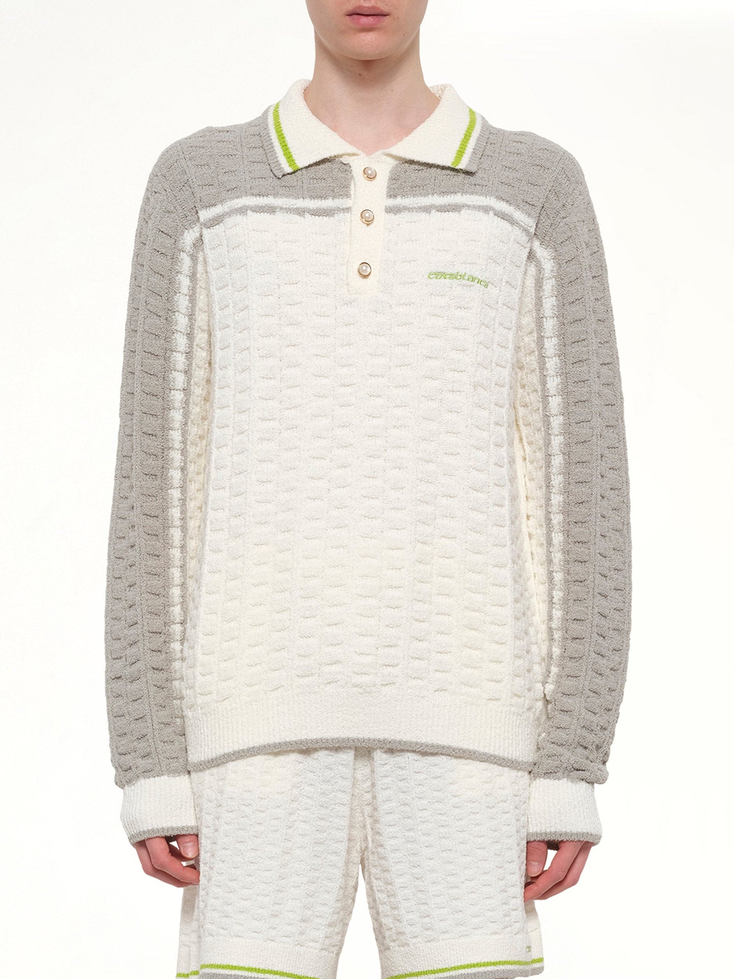 Image of a model wearing Tops. Product name - Tennis Boucle Long Sleeve Polo Shirt in White colour by brand - CASABLANCA